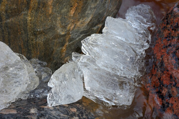 Background from broken pieces of ice. Texture, pattern, closeup