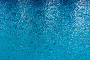 rain drops falling in the pool