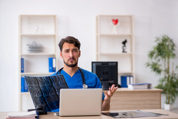 Young male doctor radiologist working in the clinic