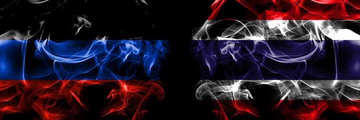Donetsk People's Republic vs Thailand, Thai flag. Smoke flags placed side by side isolated on black background.