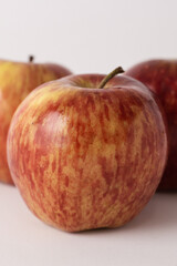 fresh red apples on a white table