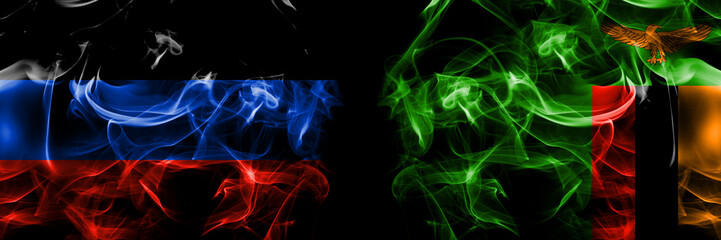 Donetsk People's Republic vs Zambia, Zambian flag. Smoke flags placed side by side isolated on black background.