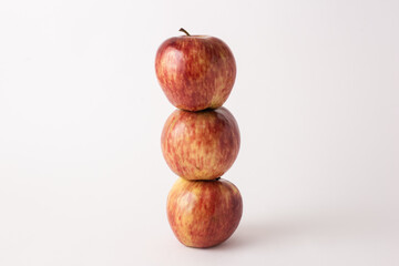 fresh red apples on a white table