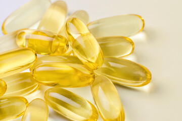 Close up of  oil filled capsules suitable for: fish oil, omega 3, omega 6, omega 9,  vitamin A, vitamin D, vitamin D3, vitamin E - Image