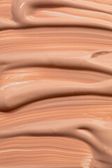 Beige nude liquid foundation texture, concealer smear smudge drop. Closeup macro. Cosmetic tonal makeup moisturizer, bb cream swatch sample.- Image
