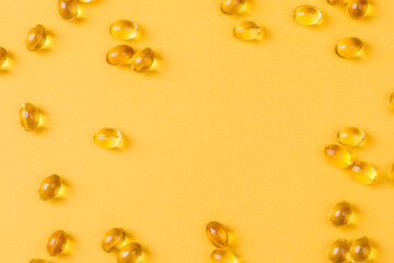 Close up of  oil filled capsules suitable for: fish oil, omega 3, omega 6, omega 9,  vitamin A, vitamin D, vitamin D3, vitamin E - Image