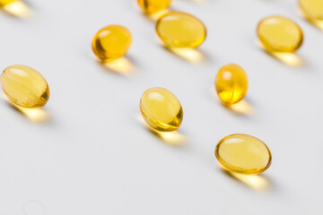 Close up of  oil filled capsules suitable for: fish oil, omega 3, omega 6, omega 9,  vitamin A, vitamin D, vitamin D3, vitamin E - Image
