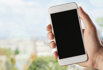 Hand hold a smartphone with a blank screen