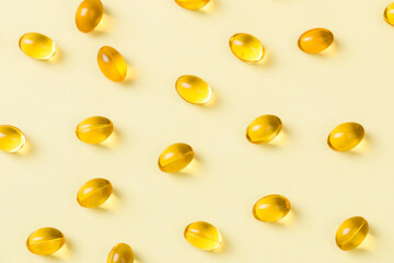 Close up of  oil filled capsules suitable for: fish oil, omega 3, omega 6, omega 9,  vitamin A, vitamin D, vitamin D3, vitamin E - Image