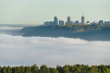 Fototapeta na wymiar Fog over the city of utor. Autumn morning fog.