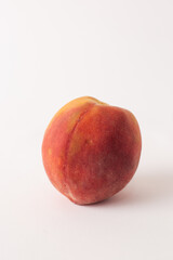 fresh peach on a white meza
