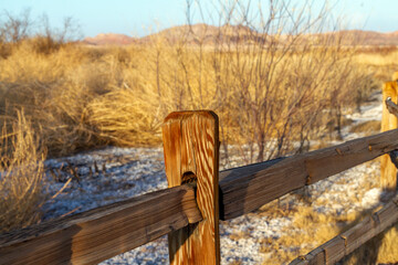 Wooden fence post and railing at a rural desert area in Southern Nevada