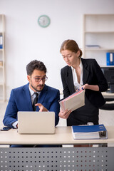Two colleagues working in the office
