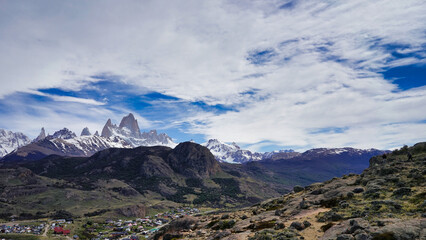 Panoramic view of Fitz Roy with snow and the town of El Chaltén