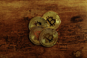 Fototapeta na wymiar Bitcoins on a wooden background.