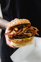 person holding a hamburger