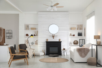 Cozy living room interior with comfortable furniture and modern electric fireplace