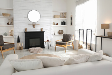 Cozy living room interior with comfortable furniture and modern electric fireplace