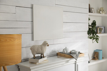 Stylish living room interior with empty canvas on white wooden wall. Mockup for design