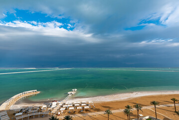 View of the Dead Sea and beach from a hotel room on an upper floor
