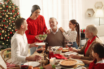 Happy family enjoying festive dinner at home. Christmas celebration