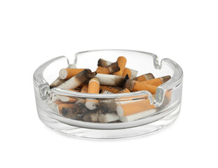 Glass ashtray with cigarette stubs isolated on white