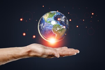 Earth in human hands. energy saving , elements of this image furnished by NASA