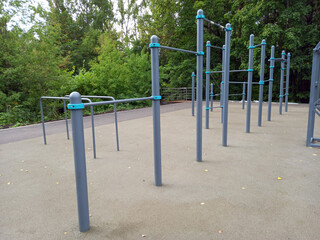 Fototapeta premium Modern outdoor sports ground with professional flooring and horizontal bars