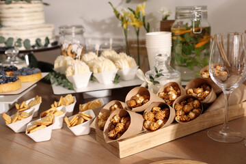 Tasty treats on table in room. Sweet buffet