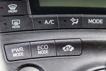 Power , eco and EV mode buttons in hybrid electric car