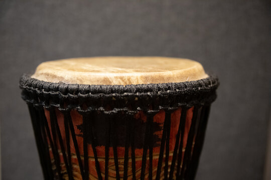A closeup of the djembe or jembe. Rope-tuned skin-covered goblet drum played with bare hands.