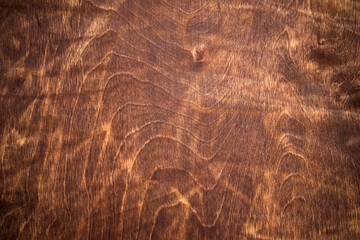 Photo of a wooden background covered with red stain.