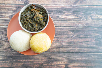Garri and Pounded Yam served with Afang Soup ready to eat