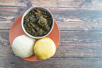 Garri and Pounded Yam served with Afang Soup ready to eat