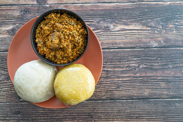 Garri and Pounded Yam served with Egusi Soup ready to eat