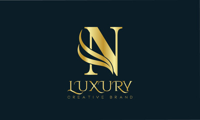 Luxury N monogram Classic Gold Lettering Typography Logo. Luxury decorative shiny vector illustration.