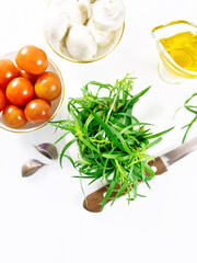 Tarragon in mortar on board top