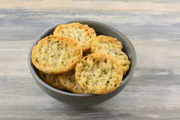 Garlic and parsley bruchetta  appetizer or snack in ceramic bowl on table