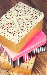 colorful gift boxes on wooden background