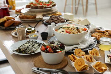 Brunch table setting with different delicious food indoors