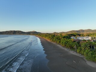 Sunlight rising over the beach at daybreak