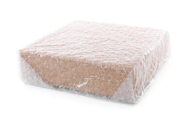 Cardboard box packed in bubble wrap isolated on white