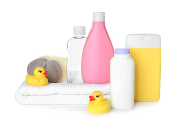 Obraz na płótnie Canvas Bottles of baby cosmetic products, towel, bath sponge and rubber ducks on white background