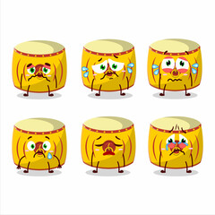 Yellow chinese drum cartoon character with sad expression