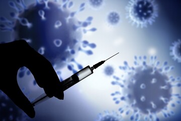 Doctor hand holding a medical syringe, covid-19 variant displayed on a screen