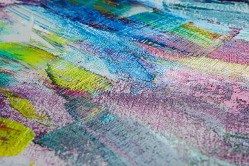 Fototapeta premium Strokes of colorful acrylic paints on canvas, closeup