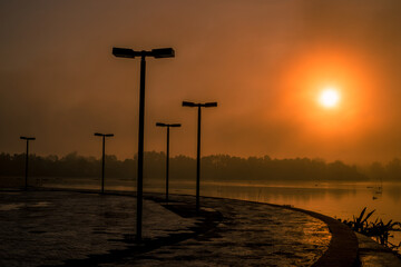 The background of the sea by the evening sea, with natural beauty (sea water, rocks, sky) and fishermen are fishing by the river bank, is a pleasure during travel.
