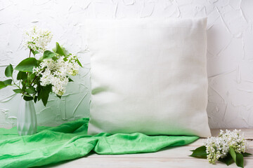 Pillow mockup with white lilac in the vase