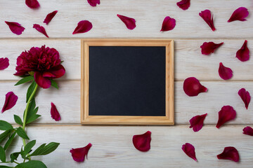Black square chalkboard frame mockup with burgundy peony and petals