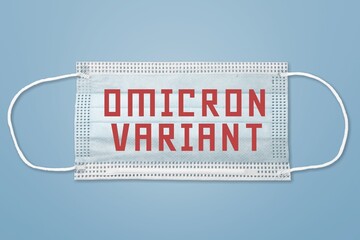 A face mask with Omicron variant text on it. Covid-19 new variant - Omicron.